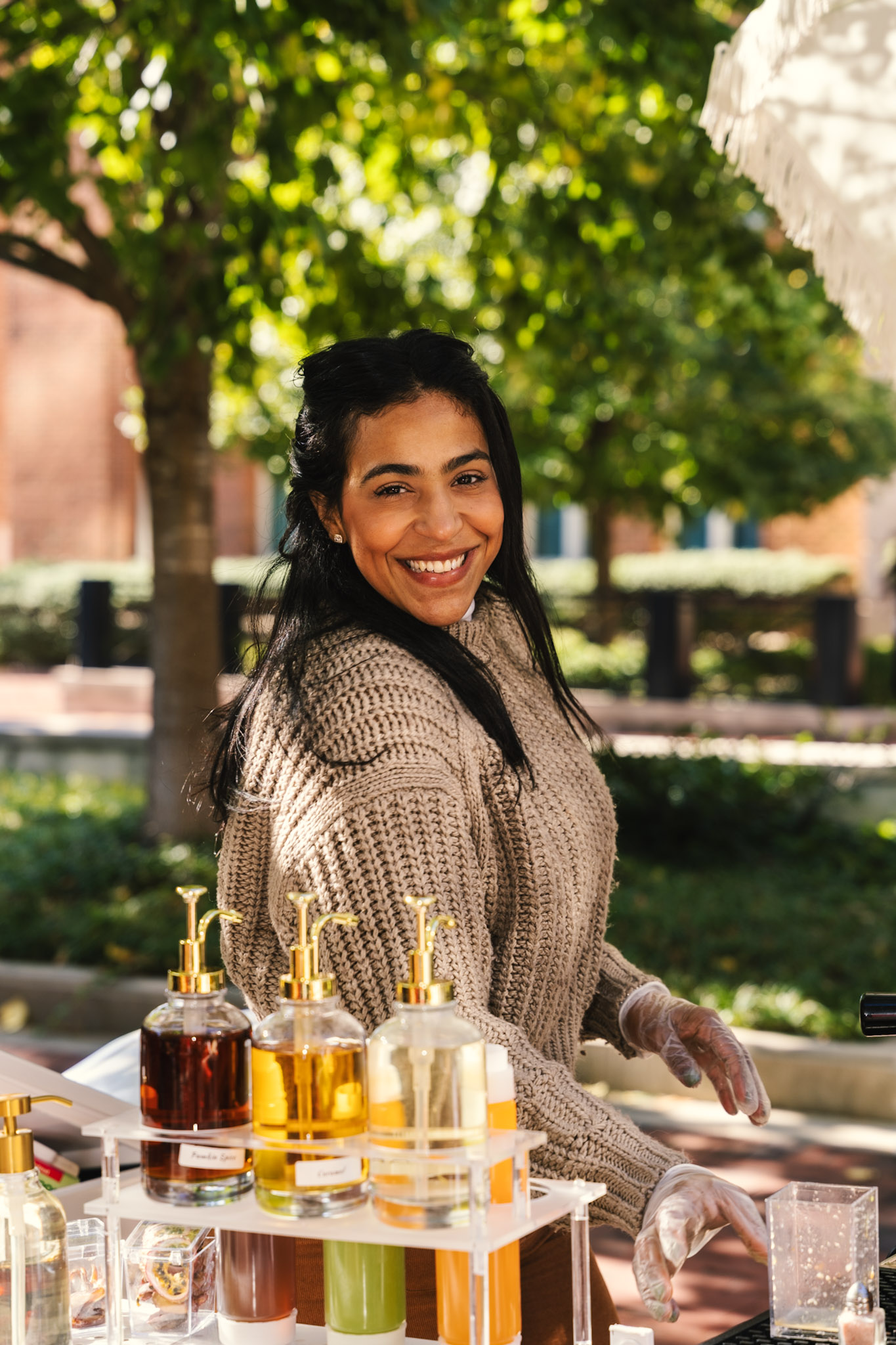 Yimelka smiling behind the coffee cart